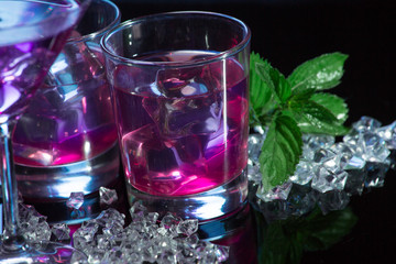 Violet coctail with ice cubes