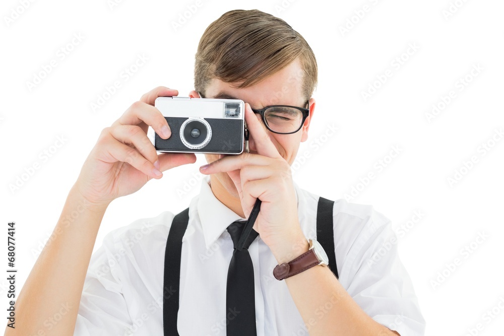 Poster geeky hipster holding a retro camera