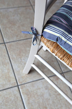 Cushion on a rustic chair in a kitchen