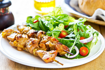 Grilled chicken skewer with salad