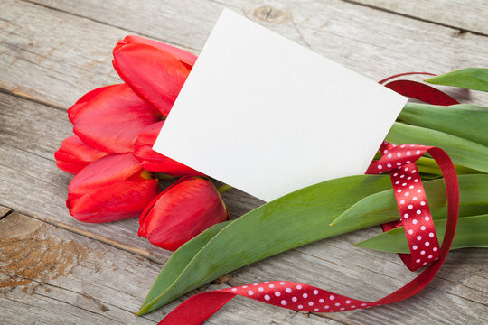 Fresh tulips bouquet and blank card for copy space