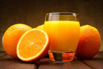 glass of Orange juice and oranges