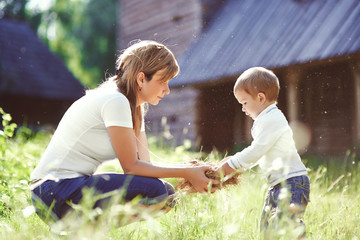 Loving mother in park playing with her son