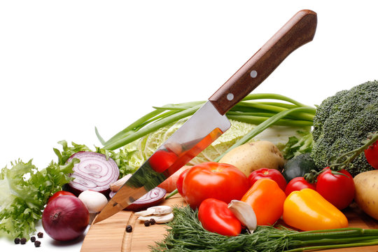 Fresh vegetables with knife