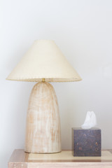 Marble desk lamp and tissue box in bedroom