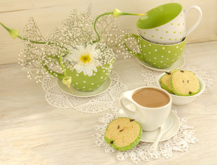Bouquet of white flowers, cup cocoa, apple shaped cookies