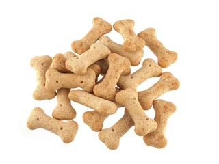 Foto auf Leinwand Close up of dog biscuits in the shape of bones © J and S Photography