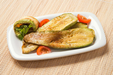 Fried zucchini with tomatoes