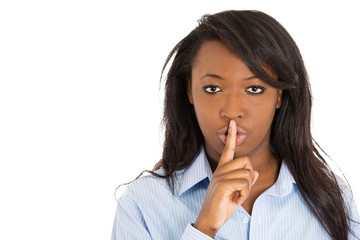 Woman placing finger to lips. Asking to keep secret be quiet 