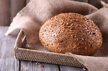 Fresh bread on wooden table, close up