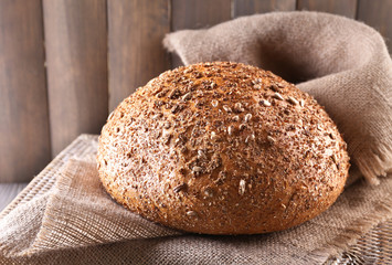Fresh bread on wooden table, close up