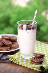 Milk cocktail in glass and chocolate cookies