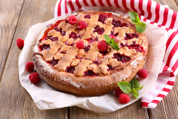 Tasty cake with berries on table close-up
