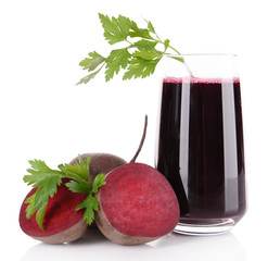 Glass of fresh beet juice and vegetables isolated on white