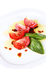 Balsamic vinegar,  tomato and basil isolated on white