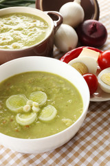 Leek soup on table, close up