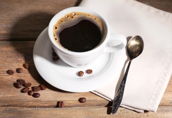 Cup of coffee on wooden background