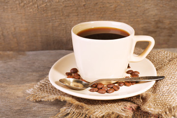 Cup of coffee on rustic wooden background