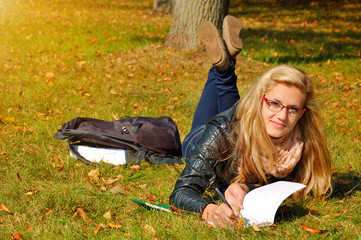 female student studying outdoors