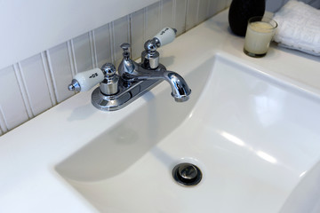 Bathroom vanity cabinet. Close up view of sink