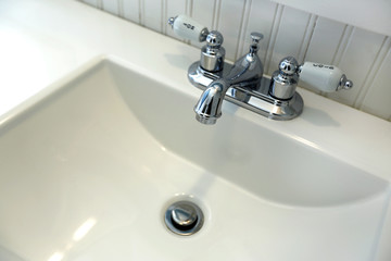 Bathroom vanity cabinet. Close up view of sink