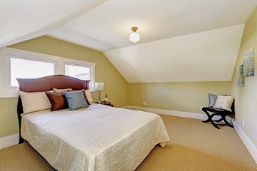 Bedroom interior with vaulted ceiling.