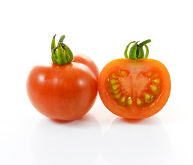 Red tomato vegetable on white background.