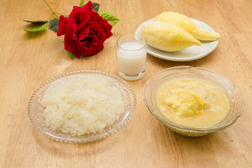 Durian and sticky rice on the wooden table