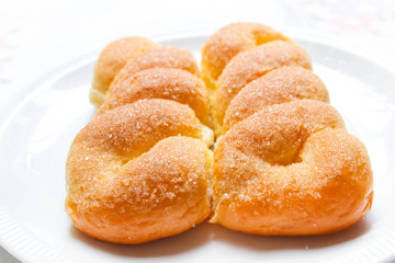 Obraz na płótnie Canvas Sweet buns with butter and sugar.