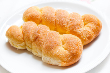 Sweet buns with butter and sugar.