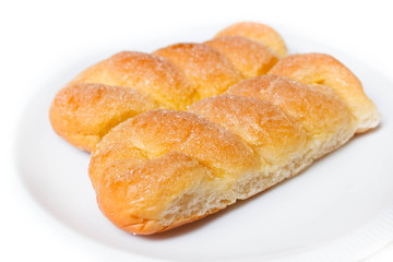 Obraz na płótnie Canvas Sweet buns with butter and sugar.