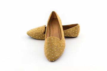 Brown flat shoes .