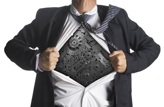 Businessman showing a superhero suit underneath machinery metal