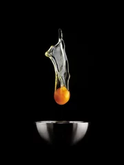 Zelfklevend Fotobehang Egg Yolk dripping. © Lovrencg