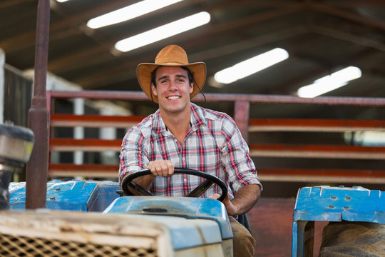 Young Farmer Driving Tractor