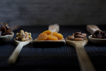 Dried Fruit and Nuts on Wooden Spoons - Selective focus