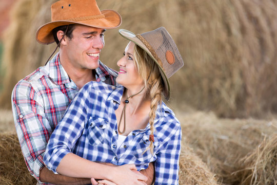 loving american western couple in barn