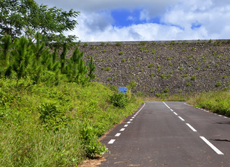road on an embankment at a reservoir of fresh water.Mauritius