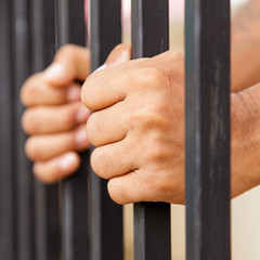 hand on cage