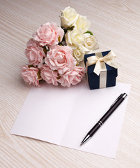 blank card with flowers and gift