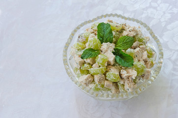 meat and vegetable salad in glass bowl