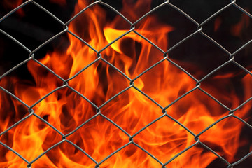 Metal net with flames burning