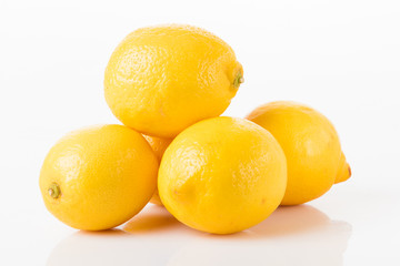 Ripe lemons isolated on white. 