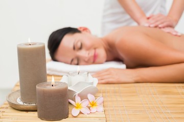 Obraz na płótnie Canvas Beautiful brunette enjoying a back massage