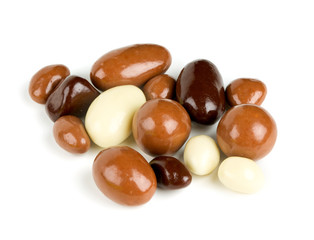 chocolate covered nuts and raisins isolated on white