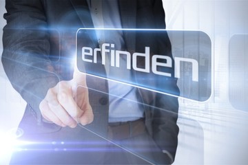 Businessman presenting the word invention in german