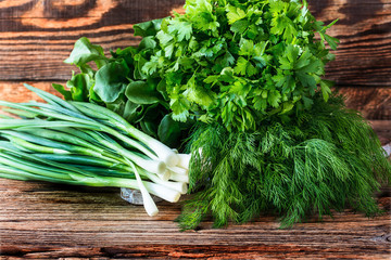 Fresh herbs on  wooden background