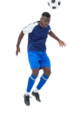 Fototapeta premium Football player in blue heading ball