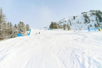 snow ski tracks in skiing area Via Lattea Italy