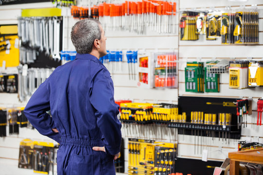 Worker With Hands On Hip In Hardware Store